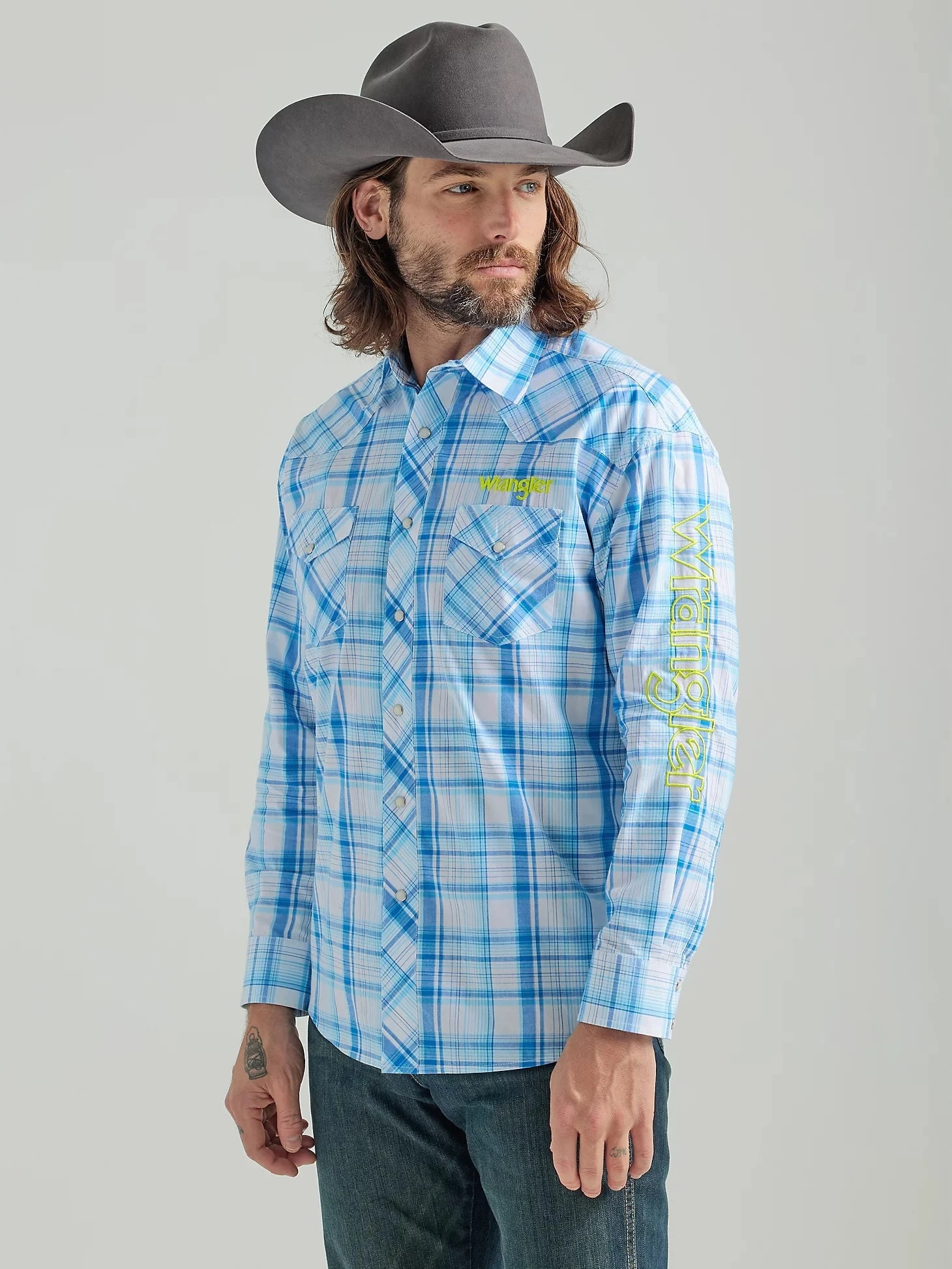 MEN'S WRANGLER® LOGO LONG SLEEVE WESTERN SNAP PLAID SHIRT IN SEA BLUE 1 MEN'S WRANGLER® LOGO LONG SLEEVE WESTERN SNAP PLAID SHIRT IN SEA BLUE