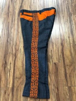PANTALONES DE CHARRO. AUTHENTIC CHARRO PANTS THAT ARE DARK GRAY COLOR WITH CARROT SUEDE LEATHER STITCHED STENCEIL ART WORK